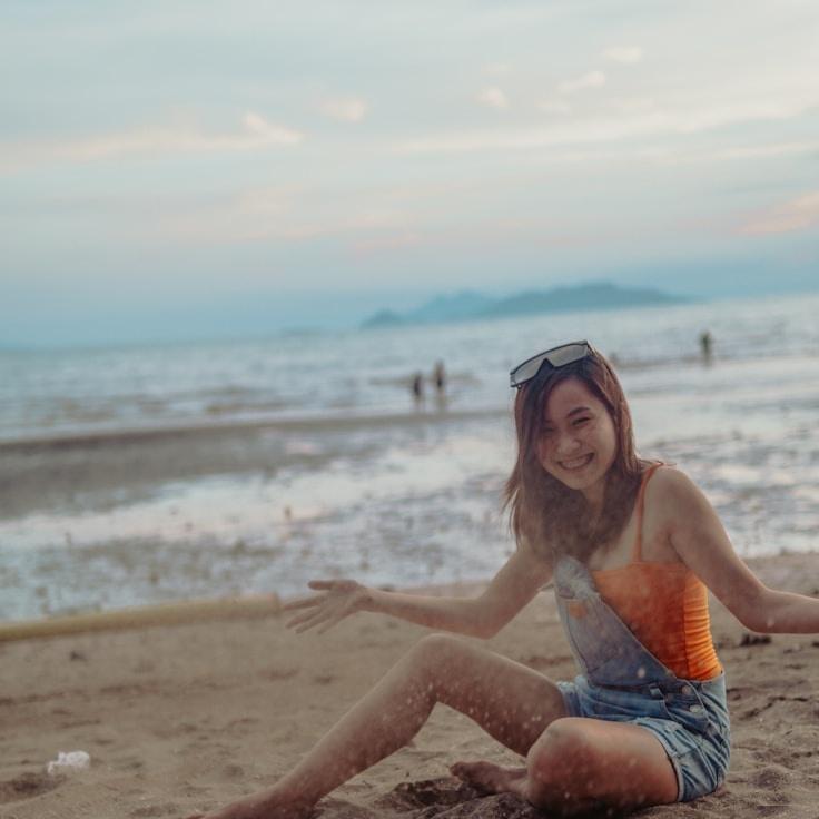 Avery Chen, Lead Design Curator at Ever Green Vector, reviewing corporate floral arrangements